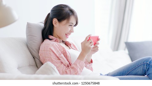 Pretty Woman Play Mobile Game By Phone And Feel Happy At Home