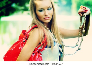 Pretty Woman With A Red Purse