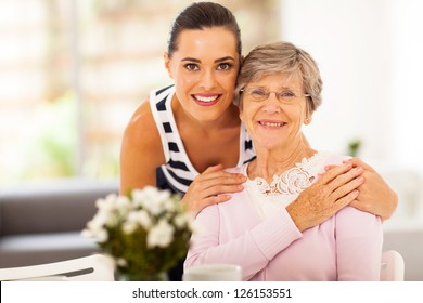 Pretty Woman And Senior Mother At Home