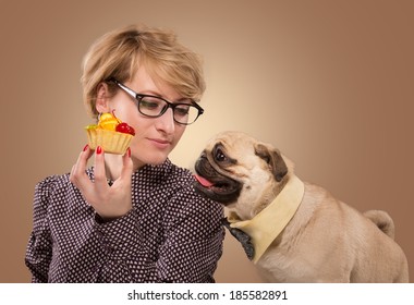 Pretty Woman Stopping Her Dog From Eating Cake