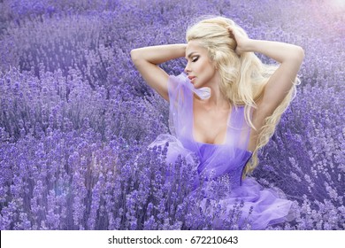 Pretty woman in summer day in lavender field. Lavender field concept.