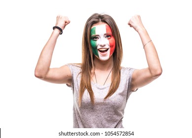 Pretty woman supporter fan of Mexico national team painted flag face get happy victory screaming into a camera.