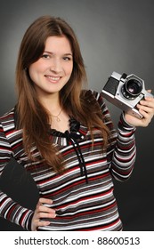 Pretty Woman Taking Photo With Vintage Camera