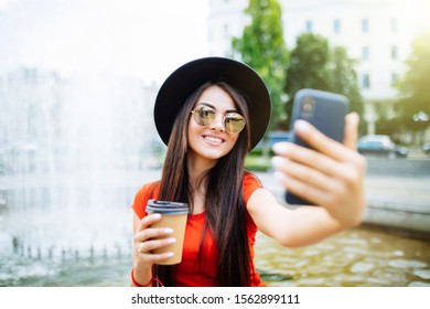 Pretty Woman Taking A Selfie With Cup Of Coffee To Go In The Street