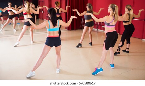 Pretty Women Funk Jazz Dancers Exercising Dance Moves In Studio