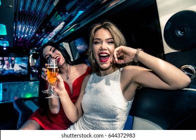 Pretty Women Having Party In A Limousine Car