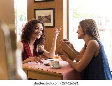 Pretty Women Talking And Having Fun Inside Coffee Shop