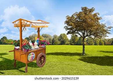 Pretty Wooden Portable Traditional Italian Picturesque Ice Cream Cart With Umbrella In A Public Park