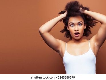 Pretty Young African American Woman With Curly Hair Posing Cheerful Gesturing On Brown Background, Lifestyle People Concept