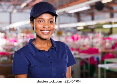 Pretty Young African Female Blue Collar Worker Inside Clothing Factory