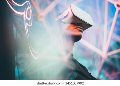 Pretty young African girl adjusting the VR headset on the modern background. - Powered by Shutterstock