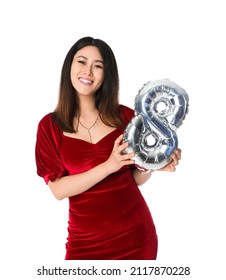 Pretty Young Asian Woman With Balloon In Shape Of Figure 8 On White Background. International Women's Day Celebration