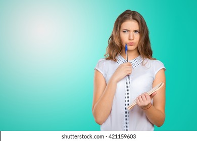 Pretty Young Beautiful Woman Standing, Writing, Take Notes, Holding Textbook Notebook Organizer In Hand And Pen