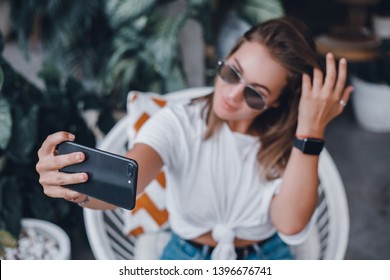 Pretty Young Beauty Woman Using Laptop in cafe, outdoor portrait business woman, hipster style, internet, smartphone, office, Bali Indonesia, holding, mac OS, manager, freelancer , make selfie, watch - Powered by Shutterstock