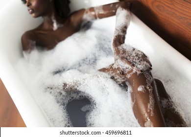 Pretty Young Black Woman In The Foam Bath