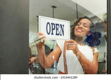 Pretty Young Black Woman Opening Her Store In The Morning