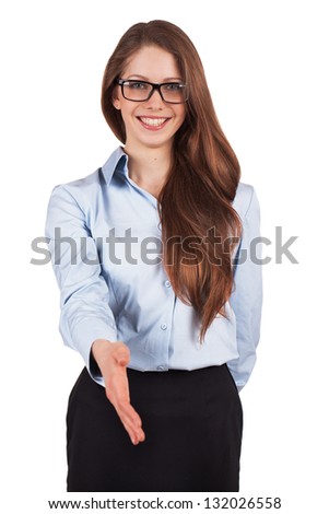 Pretty young businesswoman held out her hand in greeting
