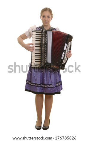 Pretty young dirndl woman playing accordion , Studio Shot