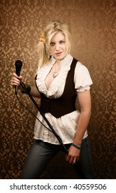 Pretty Young Female Blonde Singer Or Comedian With Microphone