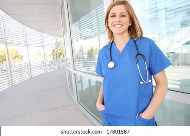 A pretty young female nurse outside hospital building