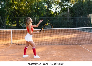 pretty, young female tennis player on the tennis court (shallow DOF, selective focus) - Powered by Shutterstock