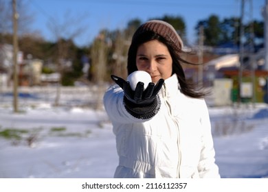 Pretty Young Girl Holding Snowball