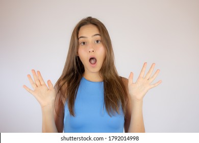 Pretty young girl making surprise gesture - Shutterstock ID 1792014998