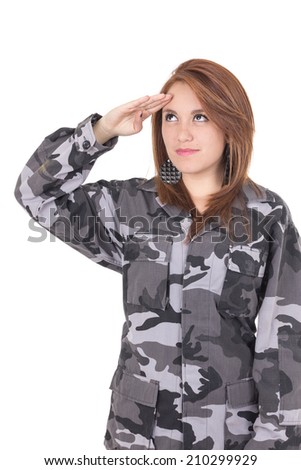 Pretty young girl in military uniform saluting isolated on white