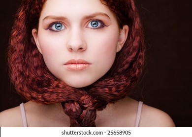 Pretty young girl with red tied hair