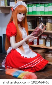 Pretty Young Girl Servant Costume Portrait Dressed In Red Role Play In The Shop Serving Tea