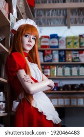 Pretty Young Girl Servant Costume Portrait Dressed In Red Role Play In The Shop