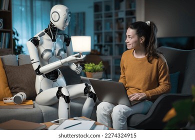 A pretty young girl studies with the help of her android equipped with artificial intelligence. Concept of usefulness of A.I. in people's daily lives. 