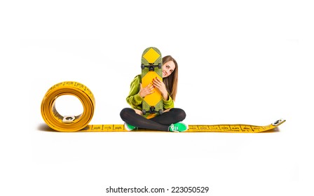 Pretty young girl wearing urban style with skateboard - Powered by Shutterstock