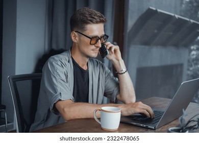 Pretty Young Handsome Man Using Laptop in cafe, outdoor portrait business man, hipster style, internet, smartphone, office, Bali Indonesia, holding, mac OS, manager, freelancer , watch, cappuccino