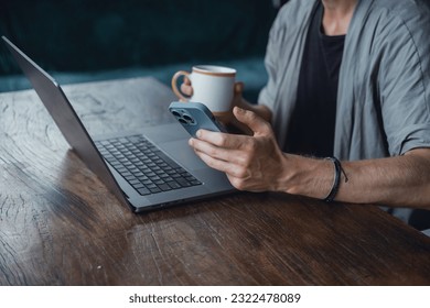 Pretty Young Handsome Man Using Laptop in cafe, outdoor portrait business man, hipster style, internet, smartphone, office, Bali Indonesia, holding, mac OS, manager, freelancer , watch, cappuccino