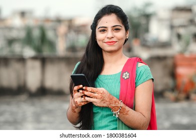 Pretty Young Indian Woman Using Her Phone.