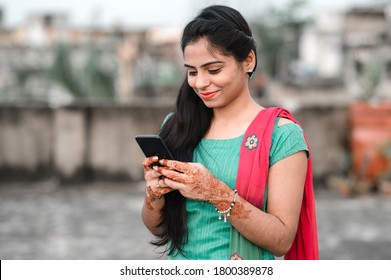 Pretty Young Indian Woman Using Her Phone.