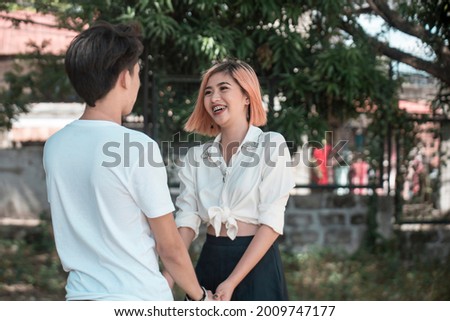 Similar – Image, Stock Photo Romantic moment with a couple sharing a strawberry on a rooftop