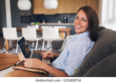 Pretty young modern woman working remotely from home - Shutterstock ID 1151830754