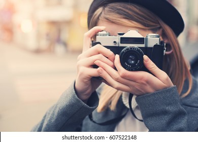 Pretty Young Photographer Taking A Shot