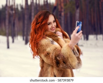 Pretty Young Red Hair Woman Making Selfie In Winter Park