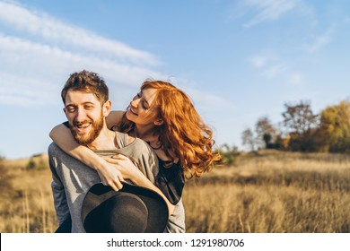 Pretty young romantic couple spend time together outdoor - Shutterstock ID 1291980706