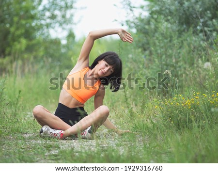 Pretty Young Skinny Woman Doing Exercises Outdoors