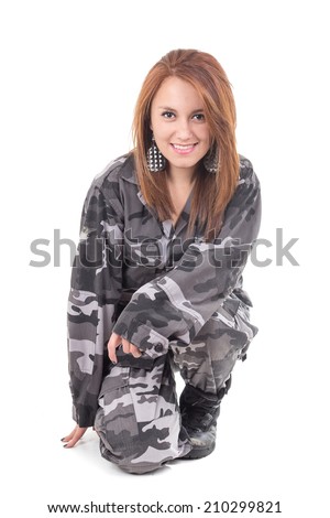 Pretty young smiling girl wearing military uniform isolated on white