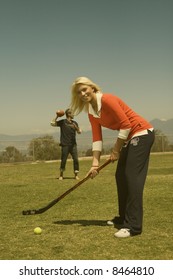 Pretty Young Teen Girl Playing Field Hockey