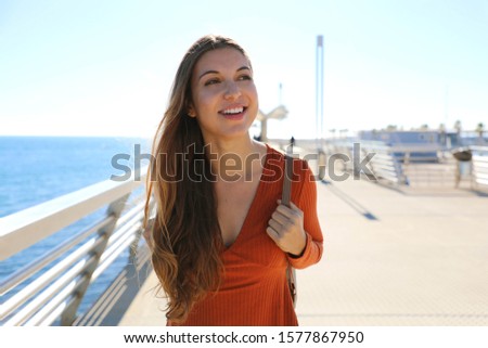 Pretty young tourist girl walking relaxing and enjoying travel in Europe.