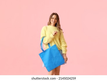 Pretty Young Woman With Blue Eco Bag On Pink Background