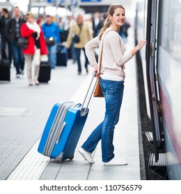 Pretty Young Woman Boarding A Train