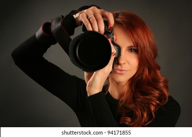 Pretty Young Woman With Camera