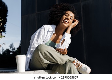 Pretty Young Woman With Coffee Outdoors